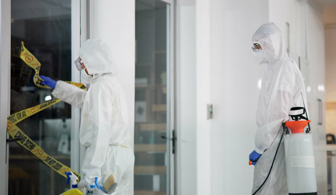 Professional worker cleaning trauma scene