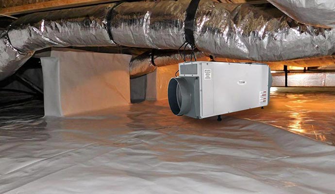 Installed dehumidification system in crawl space.